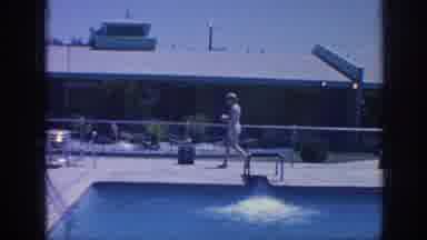 Memphis Tennessee USA (1963): Short Haired Woman Makes Her Way Around The Pool To