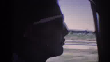 Memphis Tennessee USA (1963): A Person Donning Sunglasses Gazes Out A Car On A