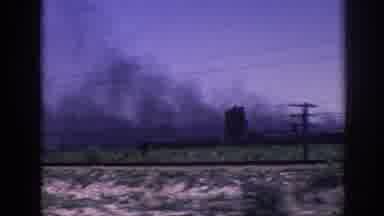 Memphis Tennessee USA (1963): Looking Out A Window From A Moving Vehicle At A Fire