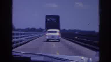 Memphis Tennessee USA (1963): Following 1960s Car And Truck On Bridge With Flagman