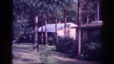 Memphis Tennessee USA (1963): Multiple Cabins In A Wooded Area With Wind Blowing