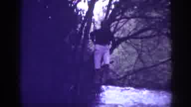 Memphis Tennessee USA (1963): Man Swats Over A Stream
