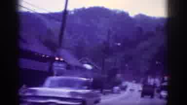 Memphis Tennessee USA (1963): Vehicles Drive Down A Road Flanked By Motels In A