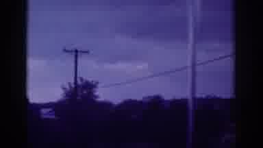Memphis Tennessee USA (1963): Driving Down Road Sun Shining Through Clouds A