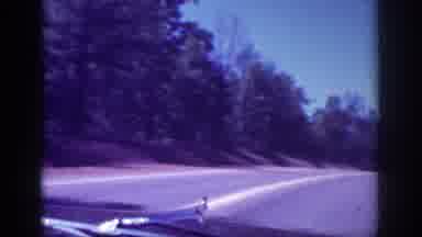Memphis Tennessee USA (1963): People Drive Down The Road And Approach A Bridge