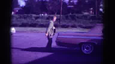 Memphis Tennessee USA (1963): Woman Closes Car Trunk