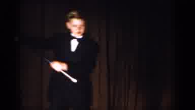 Saint Louis Missouri USA (1965): A Young Man In A Tuxedo Dancing On Stage With A