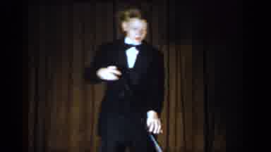 Saint Louis Missouri USA (1965): Man Wearing Black Tuxedo, Woman Wearing Hawaiian