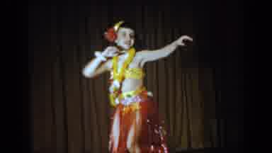 Saint Louis Missouri USA (1965): Woman Wearing Hawaiian Attire Attempts Hula Dance