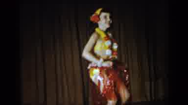 Saint Louis Missouri USA (1965): Woman Wearing Hawaiian Attire Attempts Hula Dance