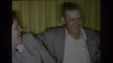 Saint Louis Missouri USA (1965): Man And Woman Playfully Embrace Before Man Leaves