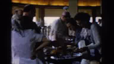 Saint Louis Missouri USA (1965): People At A Table For An Event With Food And