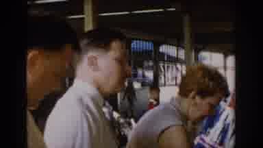 Saint Louis Missouri USA (1965): People At A Market Looking To Buy Products And
