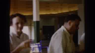 Saint Louis Missouri USA (1965): A Group Of People Eating At A Family Style Table