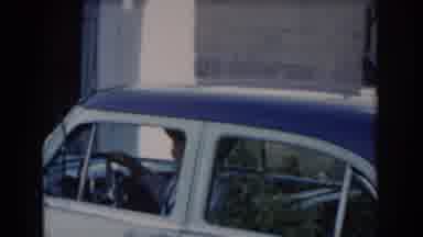Saint Louis Missouri USA (1965): Woman Closes The Door Of The Shed While Man Pulls