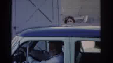 Saint Louis Missouri USA (1965): Man In Car With Man Smoking And Woman