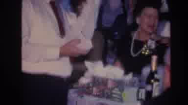 Hoboken New Jersey USA (1966): Older White Man Opens Gifts, Like A Football
