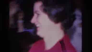 Hoboken New Jersey USA (1966): Woman Smiling While Walking Somewhere With Man