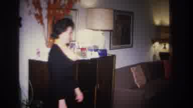 Hoboken New Jersey USA (1966): Woman Walks Into Room To Pick Up Item On Display