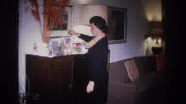 Hoboken New Jersey USA (1966): Woman Takes A Picture From The Bedside Table