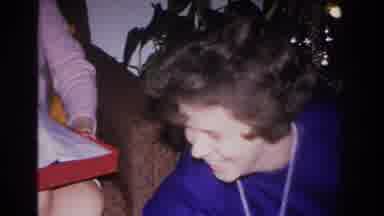 Hoboken New Jersey USA (1966): Woman Opens A Christmas Present