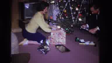 Hoboken New Jersey USA (1966): A Couple Opens Presents On The Floor, Next To A