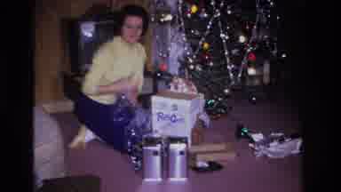 Hoboken New Jersey USA (1966): Middle Aged Woman Opening Presents On Christmas Day