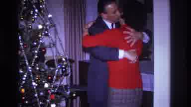 Hoboken New Jersey USA (1966): Man Wearing A Suit Kissing And Embracing Woman