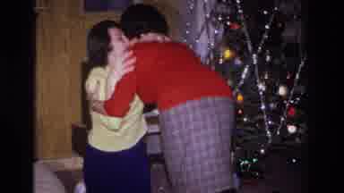Hoboken New Jersey USA (1966): Two Women Hug Next To A Christmas Tree In A Living