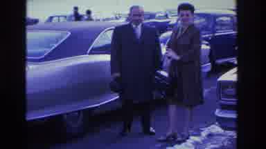 Hoboken New Jersey USA (1966): A Man And A Woman In A Car Parking Lot With Snow On