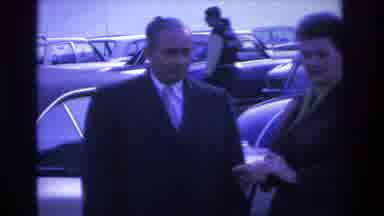 Hoboken New Jersey USA (1966): Man And Woman In A Parking Lot On A Cold Day