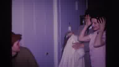 Hoboken New Jersey USA (1966): 3 People Wearing Hats, Man Takes Woman's Coat, She