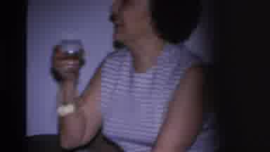 Hoboken New Jersey USA (1966): A Woman In A Striped Shirt Is Sitting On A Couch