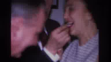 Hoboken New Jersey USA (1966): A Loving Couple Sharing Food Together While The