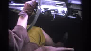 Hoboken New Jersey USA (1966): A Woman Wearing Gloves Drives A Car Down A Highway