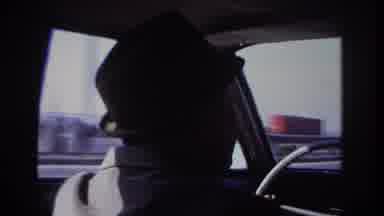 Hoboken New Jersey USA (1966): A Man With A Hat Driving His Car On The Road
