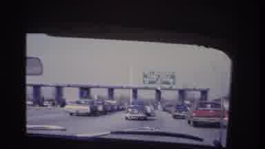Hoboken New Jersey USA (1966): Man Driving On Road Slowly Up To A Toll Booth