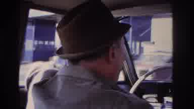 Hoboken New Jersey USA (1966): Elderly Man Driving And Older Vehicle Down The Road