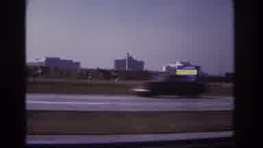 Hoboken New Jersey USA (1966): Cars Traveling On High Road Besides Tall Buildings