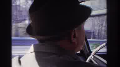 Hoboken New Jersey USA (1966): Man Driving In Old Car Under A Bridge And Through A