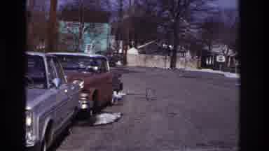 Hoboken New Jersey USA (1966): An Old Car Slowly Turns Around A Corner On A Gravel