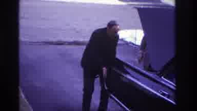 Hoboken New Jersey USA (1966): While Man Pushing The Car Woman Comes By