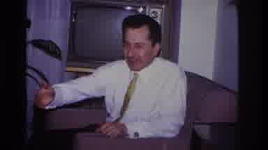Hoboken New Jersey USA (1966): A Man In A Tie Gesturing And Speaking With A Smile