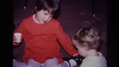 Hoboken New Jersey USA (1966): Two Girls Play With Each Other While Sitting On An