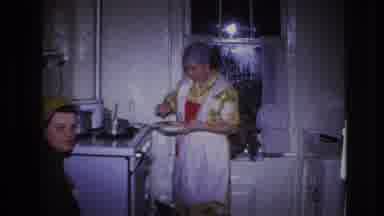 Hoboken New Jersey USA (1966): A Woman In The Kitchen Mixing Some Food In Her