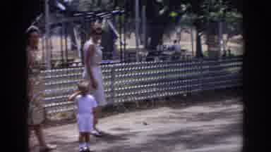 Sacramento California USA (1966): Two Women Friends Walking A Crying Child Through
