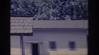 Sacramento California USA (1966): Scrolling Video Of A Yellow Cottage With A Green