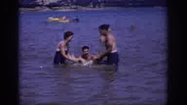 Sacramento California USA (1966): Family Of Four Plays In Lake Water In Daylight