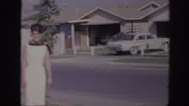 Sacramento California USA (1966): A Woman With Her Family In The Front Yard
