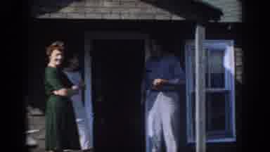 Sacramento California USA (1966): People Standing By House Watch Motorboat